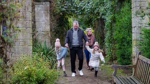 Visitors exploring the White Stag trail in the garden at Mount Stewart, County Down